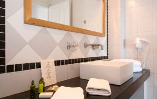 58ac2bb6ba941bff17d61898-large Antinea Hotel - Junior Suite - Bathroom Sink & Mirror