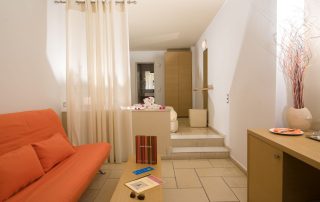 58ac2c7eba941b40182c15da-large Antinea Hotel - Junior Suite With Outdoor Jacuzzi - Living Room Area with Couch