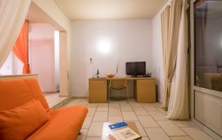 58ac2cf4ba941b891802c0e2-large Antinea Hotel - Junior Suite With Outdoor Jacuzzi - Main Area with couch and desk