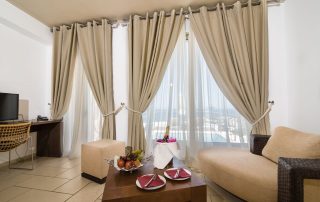 58ac34c4ba941b9b1a2d147a-large Antinea Hotel - Junior Suite With Private Pool - Living Room Couch & Champagne